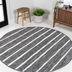 JONATHAN Y Berber Stripe Round Area Rug in outdoor setting