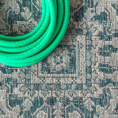 JONATHAN Y Boho Medallion Runner Rug displayed on a patio
