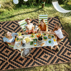 Kalafun Outdoor Patio Rug 5x8 ft black brown in outdoor setting