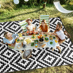 Kalafun Outdoor Patio Rug rolled up with straps