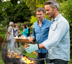 Kitchen Perfection BBQ Gloves in use with a grill