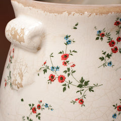 Lifestyle scene featuring Xiaan Jiaju planter on a shelf with flowers