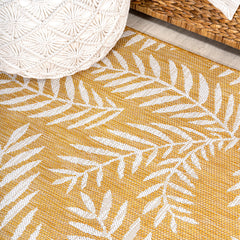 Lifestyle scene with JONATHAN Y Palm Frond Runner Rug on a patio