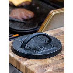 Lodge cast iron press with seasoned finish