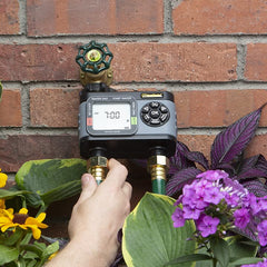Melnor HydroLogic Digital Hose Timer showing LCD display
