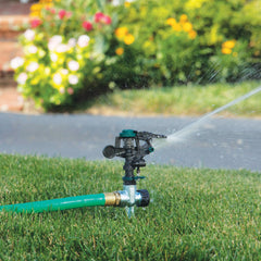 Melnor Pulsating Sprinkler in a garden setting watering plants