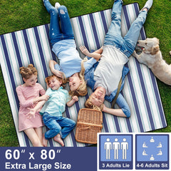 memKiya picnic blanket laid out on grass