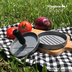 Meykers Hamburger Press making a burger patty on the grill