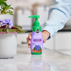 Miracle-Gro Blooming Houseplant Food in a watering can