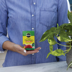 Miracle-Gro Plant Food bottle with measurement markings