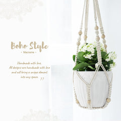 Mkono Macrame Plant Hanger 35 Inch hanging on a patio
