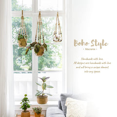 Mkono macrame plant hanger hanging from a balcony