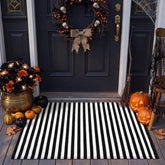 Moucuny 2' x 3' black and white Halloween striped outdoor rug front view