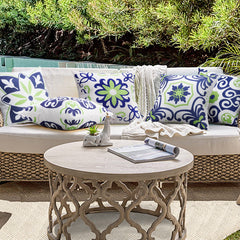 Navy blue floral printed pillow covers on a balcony