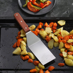 New Star Foodservice Grill Turner being used on grill