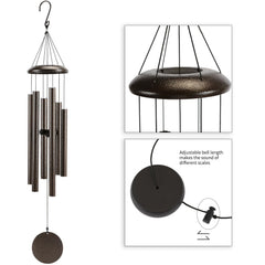 Njeury wind chime hanging outdoors with greenery