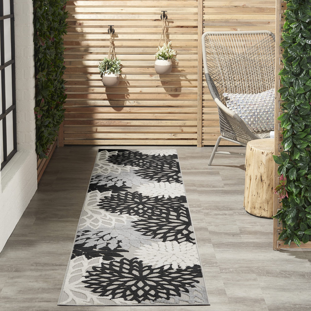 Nourison Aloha 2'3" x 10' area rug in black and white floral design