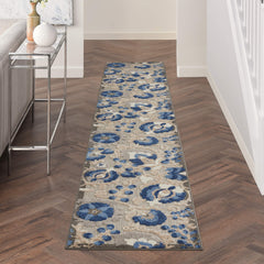 Nourison Aloha Natural Blue Area Rug in a living room