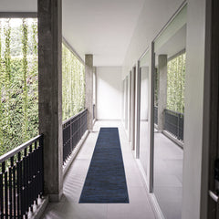 Nourison Essentials Midnight Blue 2'2" x 14' rug in outdoor setting