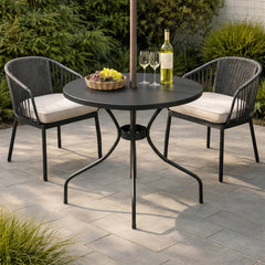 Novabright patio table with umbrella in a garden setting
