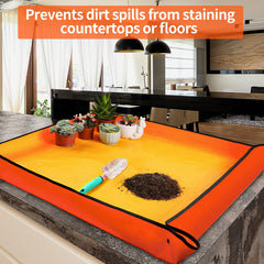 Onlysuki Repotting Mat assembled with soil and plants on it