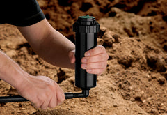 Orbit 1/2" x 100' Pro-Blend Flex Pipe connected to sprinkler head