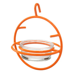 Outdoor setting featuring Monarch Abode Hanging Bird Feeder decorated with oranges