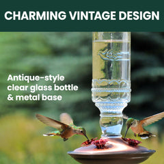 Perky-Pet Hummingbird Feeder hanging in a garden setting