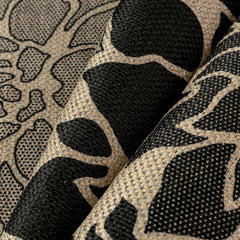 PureCozy 5x8 Black Outdoor Rug in garden setting