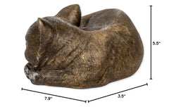 Roman Bronze Sleeping Cat Statue in garden setting