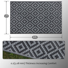 SAND MINE Outdoor Rug 5x8 ft on a patio with furniture