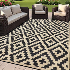SAND MINE reversible outdoor mat in black and beige, front view