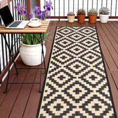 SAND MINE Reversible Outdoor Rug front view, black and beige lattice design