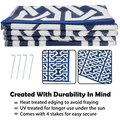 SAND MINE Reversible Outdoor Rug on a patio with furniture