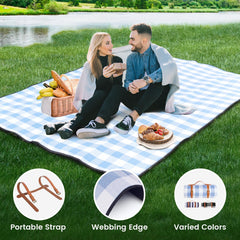 sapsisel picnic blanket on a sandy beach with people relaxing