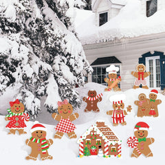 Set of 10 Christmas Gingerbread Yard Signs displayed in a garden
