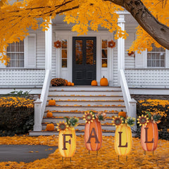 set of 4 metal pumpkin garden stakes in autumn garden