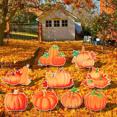 Set of 9 pumpkin yard signs laid out with stakes