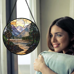 Side view of AMDERVEN stained glass suncatcher hanging in window