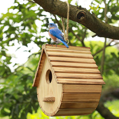 Side view of STARSWR birdhouse hanging in a garden