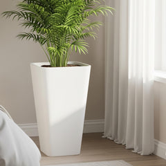 Side view of Worth Garden white plant pot on patio