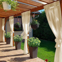 SpaceDresser Outdoor Sheer Curtain beige hanging on patio