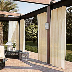 SpaceDresser Outdoor Sheer Curtain beige panel in outdoor setting
