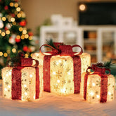 SPRKLINLIN Set of 3 Lighted Boxes featuring gold snowflake design