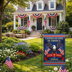 Suswoos garden flag displayed in a garden setting