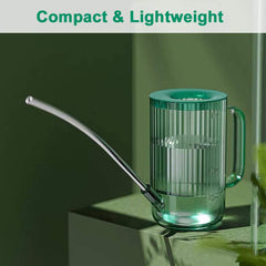 Tennedriv Green Small Watering Can on a shelf with plants