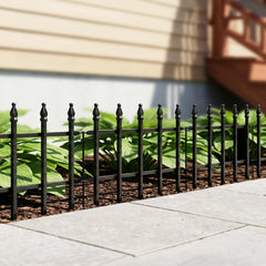 Thealyn Decorative Metal Fence set up around flower bed