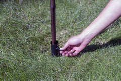 TIKI Metal Torch Stakes pack of four with outdoor setting