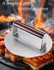 Twfatflt 2.5 lb Burger Press on a grill with burgers being cooked