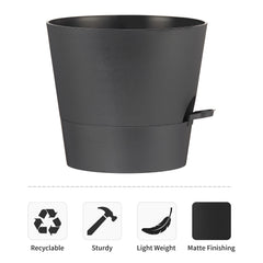 Two FaithLand self watering planter pots, black, on a wooden table